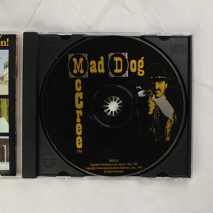 Mad Dog McCree CD-ROM lemez a nyitott tokban
