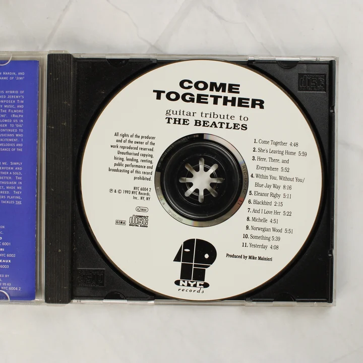 A Come Together: Guitar Tribute to The Beatles CD lemeze a tokban