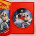 Nyitott tok a Toy Story 2 CD-vel és a kézikönyvvel