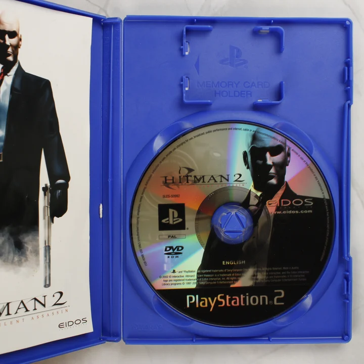 Hitman 2 Silent Assassin PS2 lemez és tok Nyitott Hitman 2: Silent Assassin PS2 tok a lemezzel és az útmutatóval