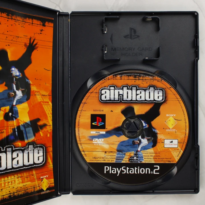 AirBlade PS2 belső Nyitott AirBlade PS2 tok a játéklemezzel