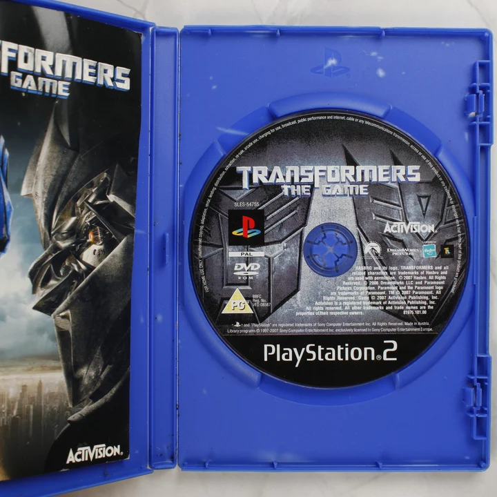 Transformers The Game nyitott tok lemezzel és kézikönyvvel