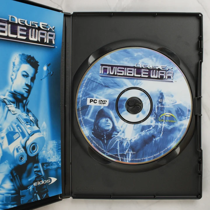 Deus Ex Invisible War nyitott tok a lemezzel és a kézikönyvvel