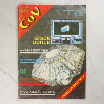 A Commodore Világ 25. számának színes borítója egy űrhajó grafikájával.