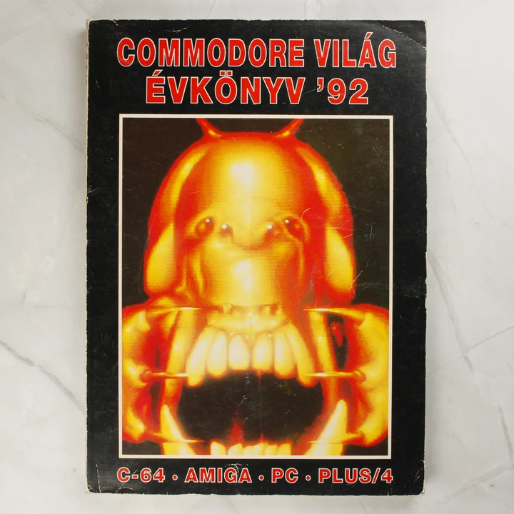A Commodore Világ Évkönyv '92 első borítója egy narancssárga lénnyel.