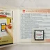 Nyitott Nintendo DS tok a játékkal és az útmutatóval
