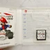 Nyitott Mario Kart DS tok a játékkal és kiskönyvvel