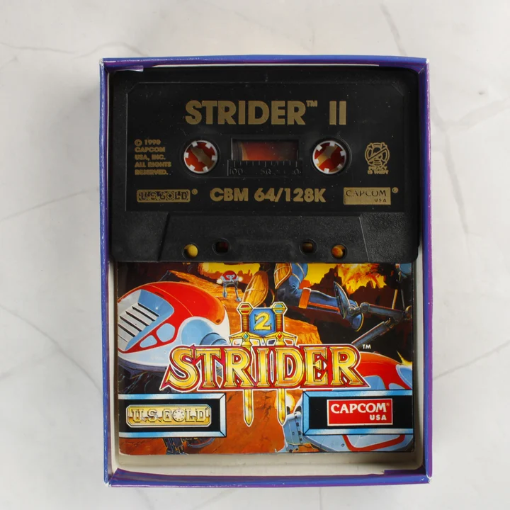 Strider II kazetta és útmutató a dobozban