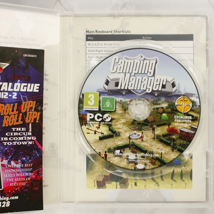 Camping Manager PC lemez és belső Nyitott tok a Camping Manager CD-ROM lemezzel és mellékletekkel
