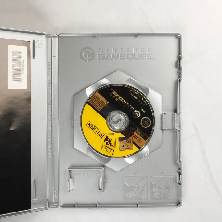 Nyitott GameCube tok belső nézet Nyitott GameCube tok The Simpsons lemezzel
