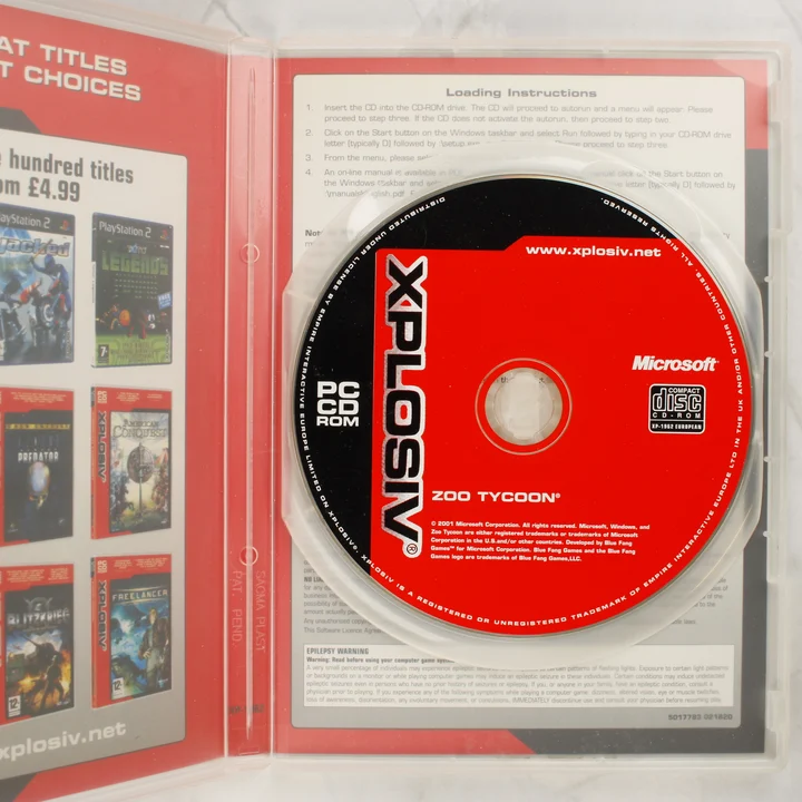 Zoo Tycoon PC CD-ROM lemez a nyitott tokban
