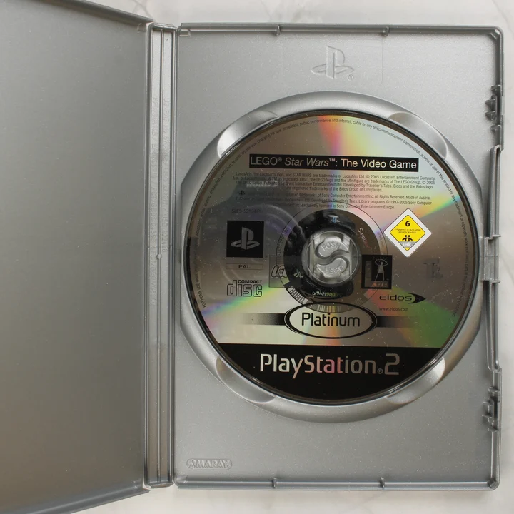 LEGO Star Wars The Video Game PS2 Platinum lemez a nyitott tokban