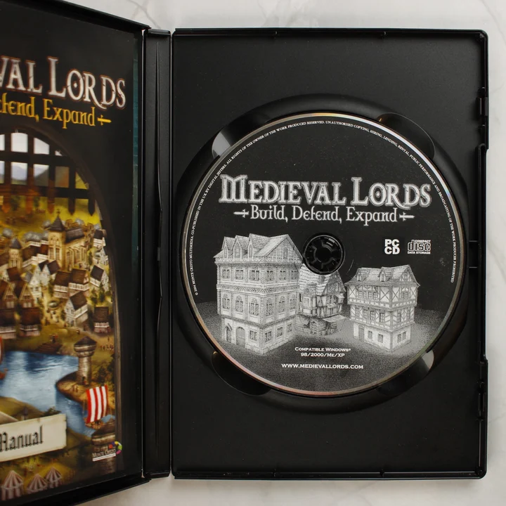 Nyitott Medieval Lords játéktok a lemezzel és az útmutatóval
