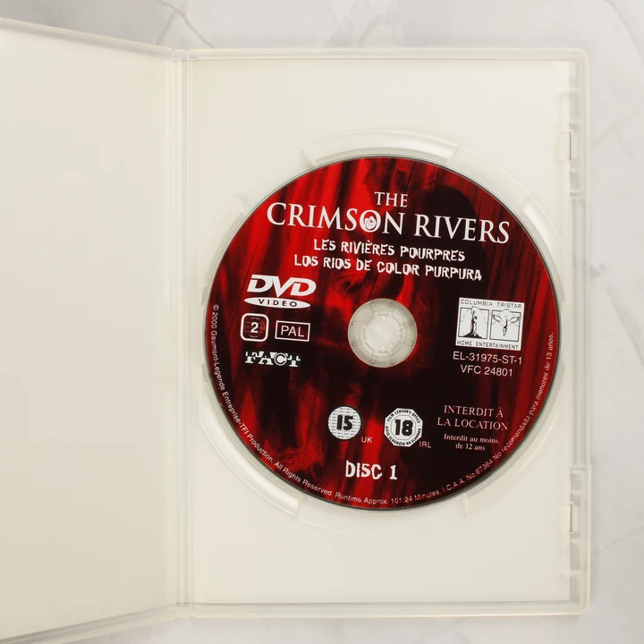 A Bíbor folyók DVD-lemez a nyitott tokban