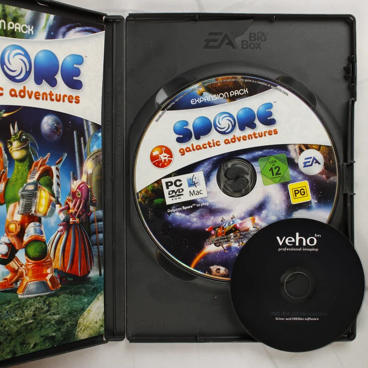 Spore Galactic Adventures belső tartalom Nyitott Spore Galactic Adventures tok lemezekkel és kézikönyvvel
