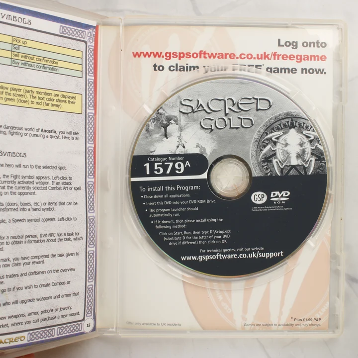 Nyitott Sacred Gold DVD-tok a lemezzel és a kézikönyvvel