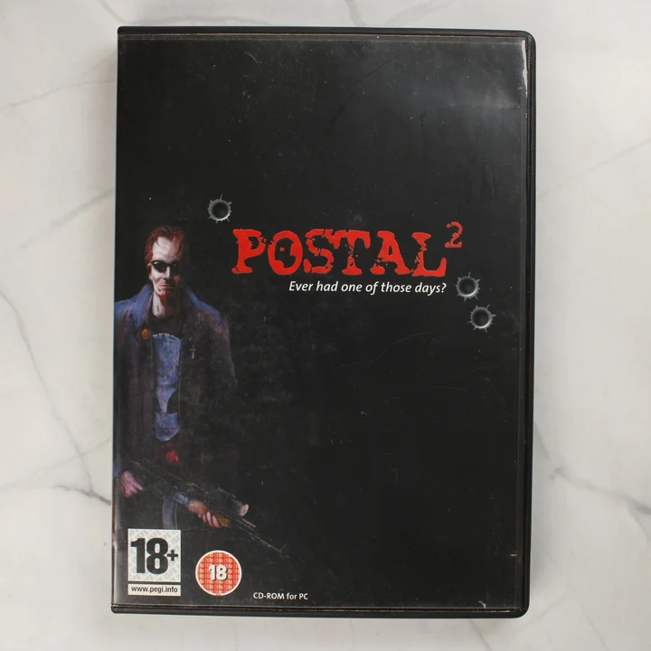 Postal 2 PC videójáték előlapja fekete tokban