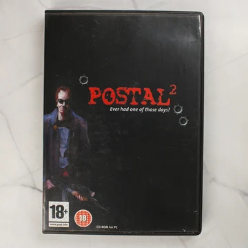 Postal 2 PC videójáték előlapja fekete tokban