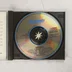 A nyitott CD-tok és maga az optikai lemez