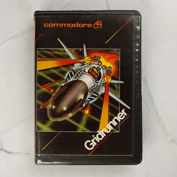 Gridrunner Commodore 64 videójáték tokjának előlapja űrhajós illusztrációval
