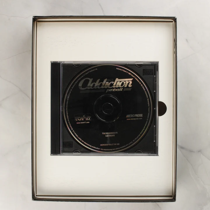 Addiction Pinball lemez Addiction Pinball CD-ROM a műanyag tokban a doboz belsejében