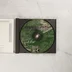 A nyitott CD-tok és a zöld mintás CD-ROM lemez