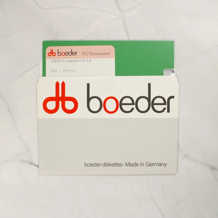 Zöld 5,25 colos floppy lemez a Boeder tartótokban