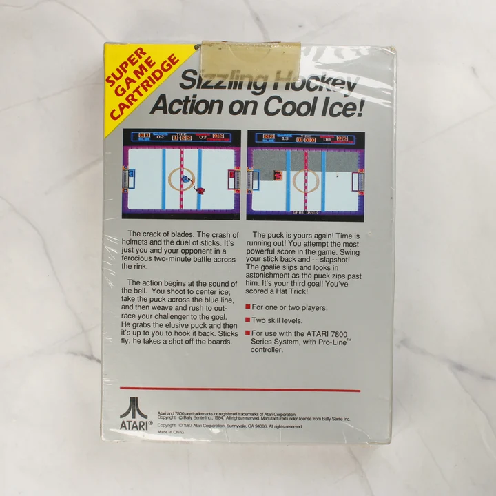 Atari 7800 Hat Trick hátlap Atari 7800 Hat Trick videójáték dobozának hátoldala