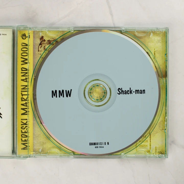 Medeski Martin and Wood - Shack-man CD lemez A nyitott CD-tok a világoskék színű lemezzel
