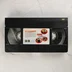 Fekete Fuji VHS kazetta a Ford Fairlane kalandjai színes matricájával