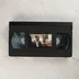 A Hetedik című film fekete műanyag VHS kazettája a középső képes címkével