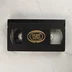 Fekete VHS-kazetta arany színű MOKÉP RT. VIDEO logóval a közepén