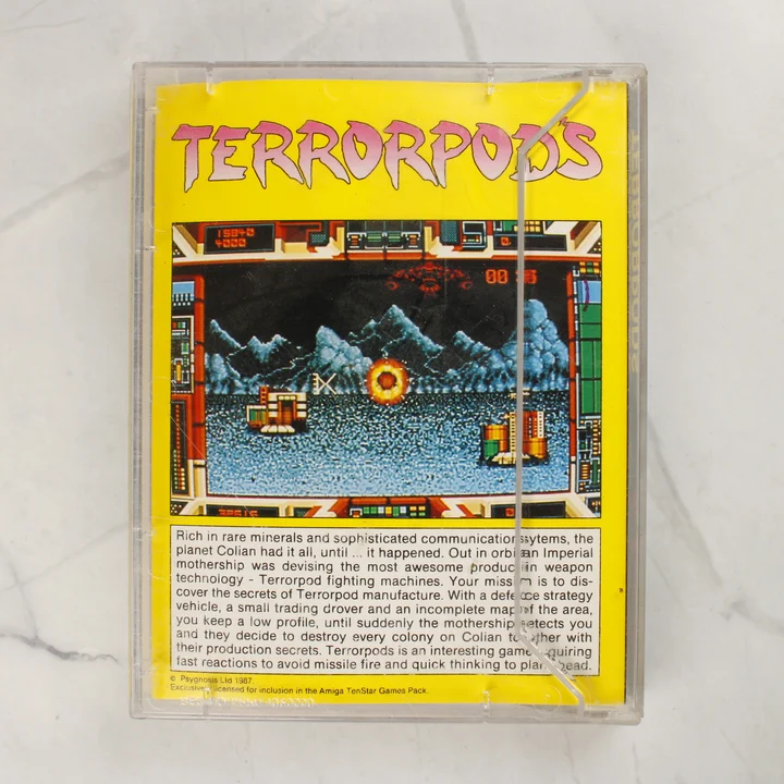 Terrorpods Amiga játék hátlapi borító A Terrorpods Amiga videójáték tokjának hátoldala sárga háttérrel és leírással