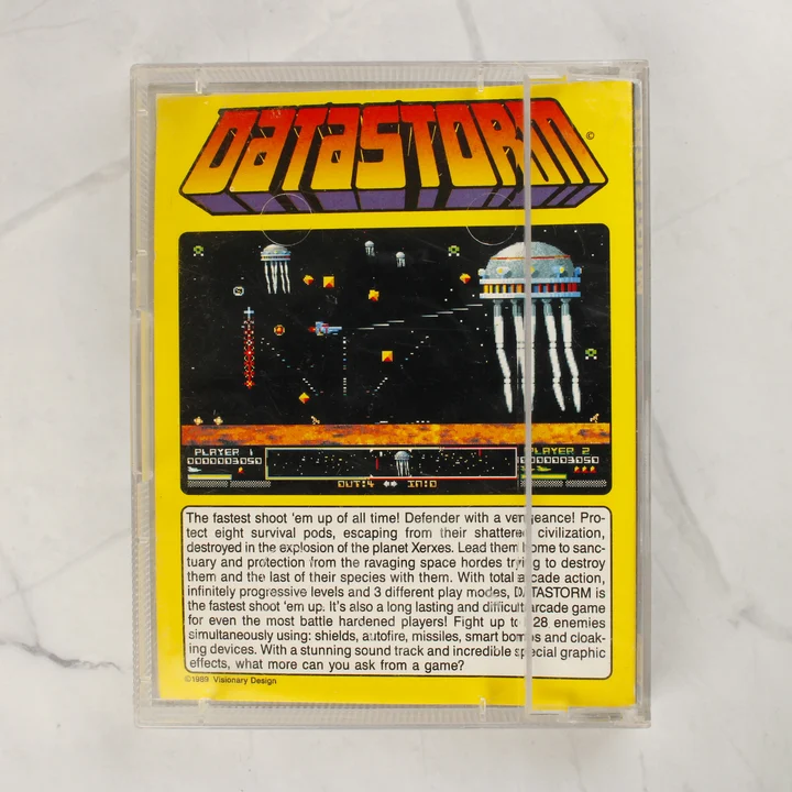 A Datastorm Amiga játék hátulsó borítója a leírással és képernyőképpel