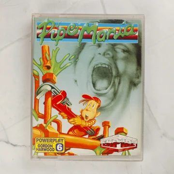 A Pipe Mania Amiga videójáték műanyag tokjának előlapja a színes illusztrációval