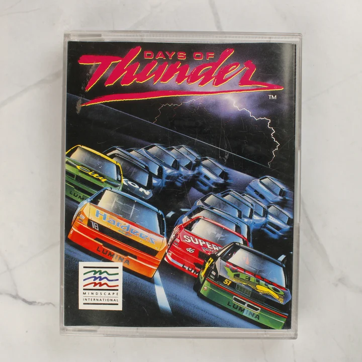 Days of Thunder Amiga játék elölnézet A Days of Thunder Amiga videójáték tokjának előlapja színes versenyautós grafikával