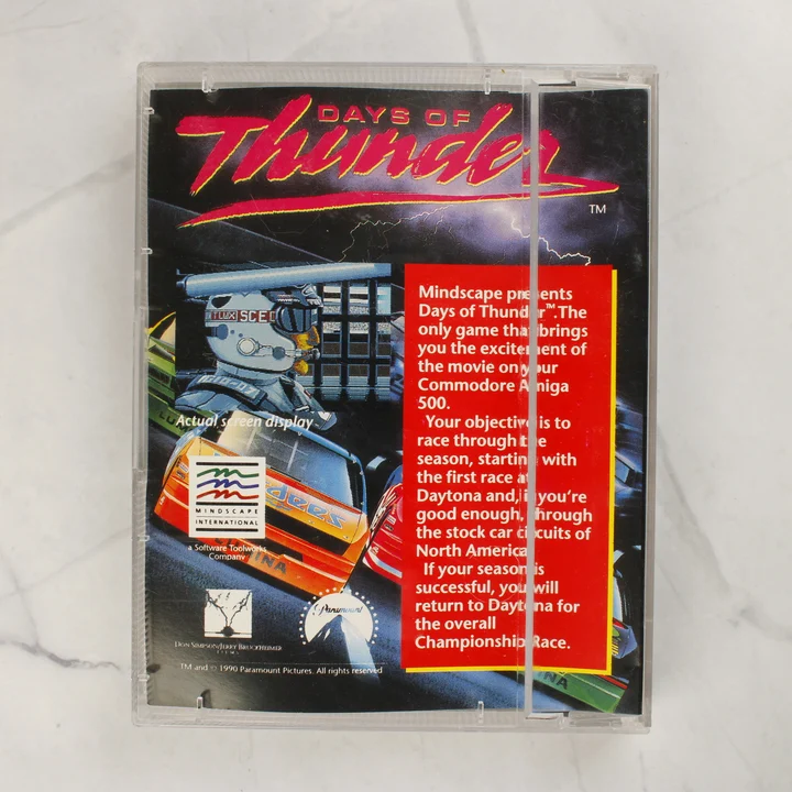 Days of Thunder Amiga játék hátnézet A Days of Thunder Amiga videójáték tokjának hátlapja a leírással