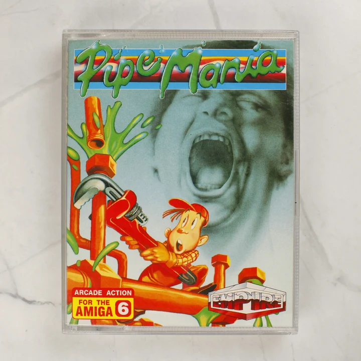 A Pipe Mania Amiga játék színes előlapi borítója átlátszó műanyag tokban