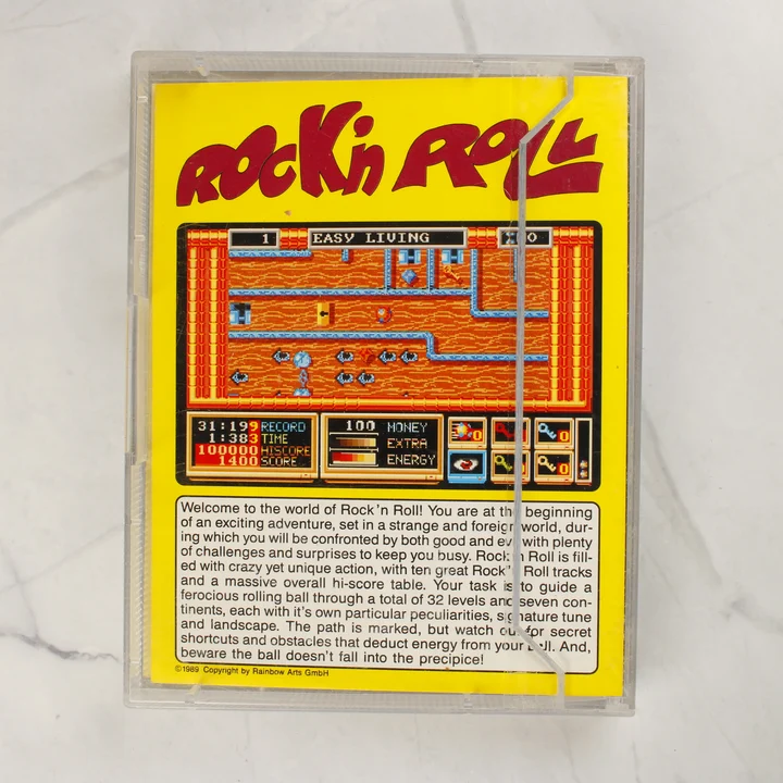 Rock'n Roll Amiga játék hátlap A Rock'n Roll Commodore Amiga videójáték tokos hátlapja sárga alapon leírással