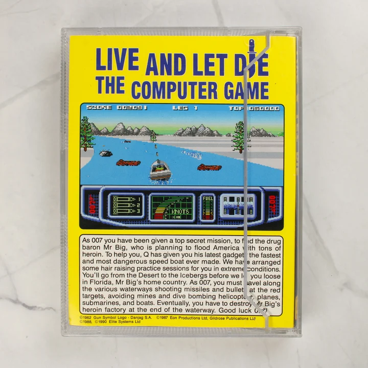 Live and Let Die Amiga játék hátlap A Live and Let Die Amiga videójáték tokjának hátoldala sárga alapon játékleírással