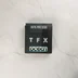 A TFX videójáték belső fekete tartódoboza felülről fotózva