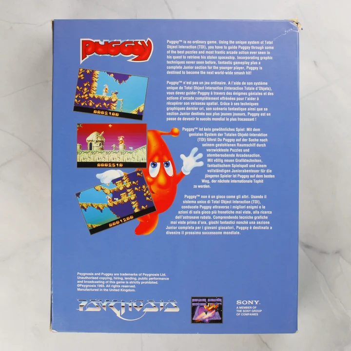 Puggsy Amiga játék doboz hátlap A Puggsy Amiga játék külső dobozának hátoldala a leírásokkal és képernyőképekkel