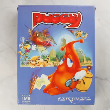 A Puggsy Amiga játék színes, illusztrált külső dobozának előlapja