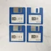 Négy darab kék színű 3,5 colos floppy lemez a SimLife és SimCity játékokhoz