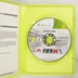 Nyitott zöld Xbox 360 tok a FIFA 14 játéklemezzel és a kézikönyvvel