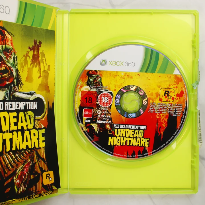 A nyitott Xbox 360 tok a Red Dead Redemption: Undead Nightmare játéklemezzel és a kiskönyvvel