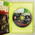 Nyitott Xbox 360 tok a Dead Island Riptide játéklemezzel