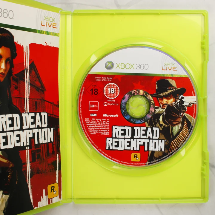 Red Dead Redemption Xbox 360 belső A nyitott Xbox 360 tok a Red Dead Redemption lemezzel és a kézikönyvvel