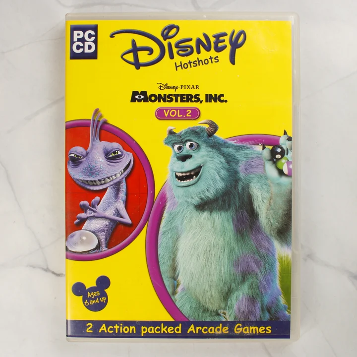 Disney Hotshots Monsters Inc Vol 2 PC játék borító előlapja sárga háttérrel és a szereplőkkel
