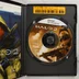 A Halo 2 nyitott tokja a DVD-lemezzel, a kézikönyv szélével és a sárga termékkulcs matricával